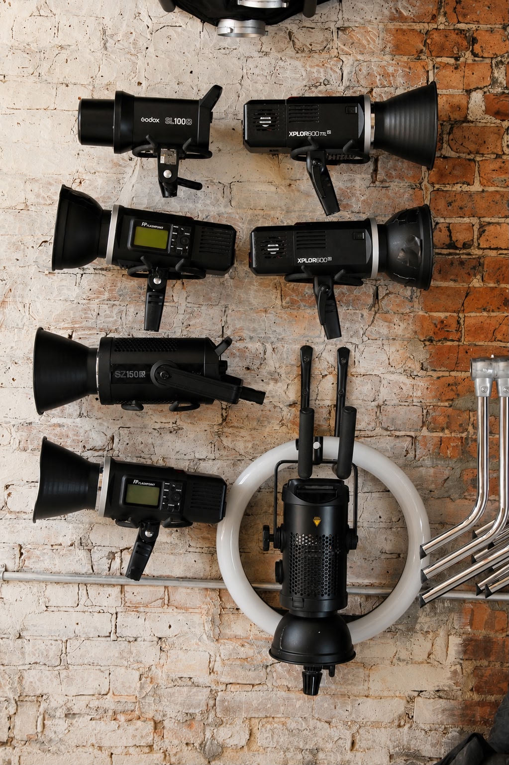 Wall display of Godox and Flashpoint strobes